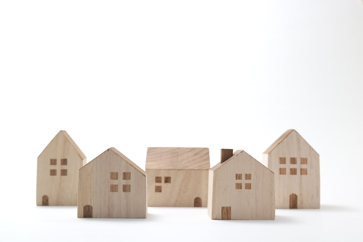 Miniature houses on white background